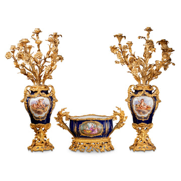 A FRENCH 19TH CENTURY LOUIS XV ST. THREE-PIECE ORMOLU AND SEVRES PORCELAIN GARNITURE.