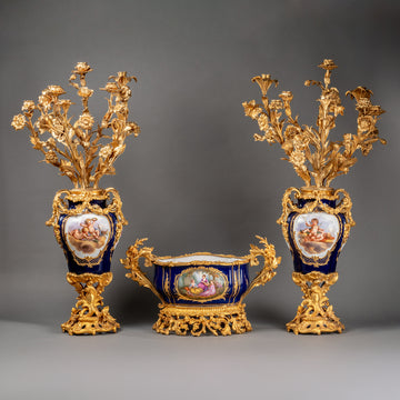 A FRENCH 19TH CENTURY LOUIS XV ST. THREE-PIECE ORMOLU AND SEVRES PORCELAIN GARNITURE.