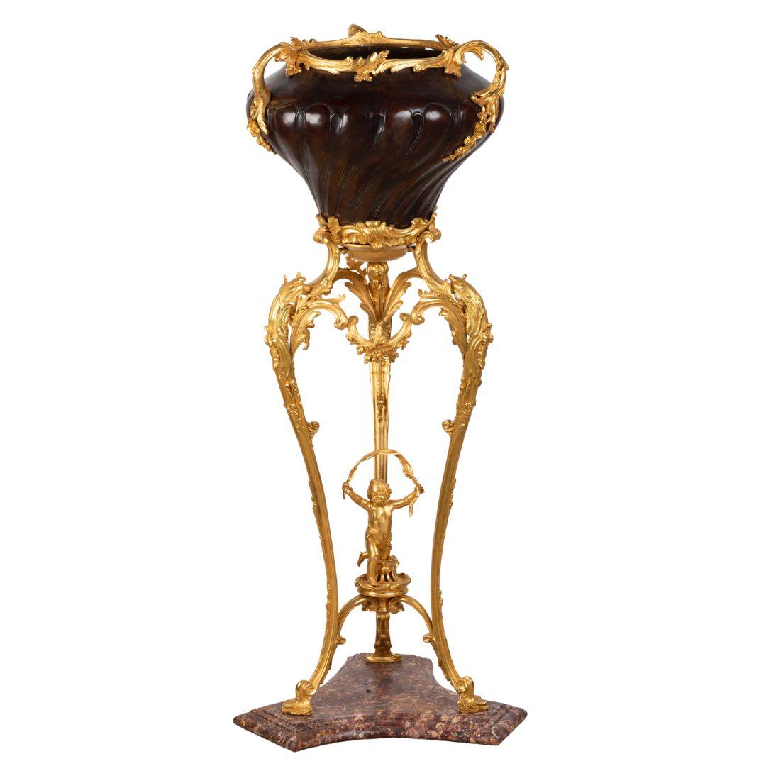 A FRENCH 19TH CENTURY GILT AND PATINATED BRONZE JARDINIERE ON STAND SIGNED MILLET. - Galerie Rosiers
