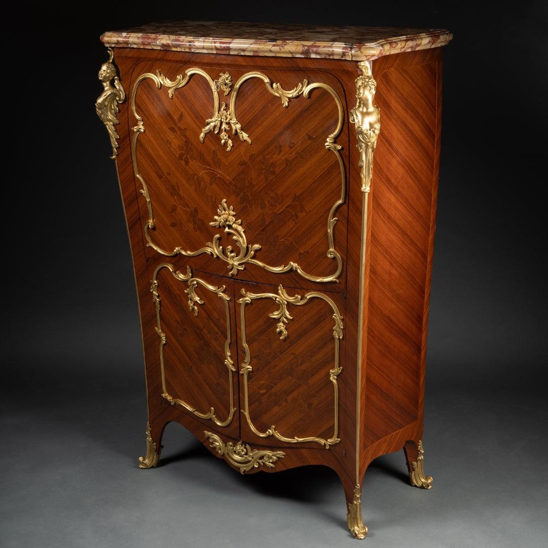 A FRENCH 19TH CENTURY LOUIS XV ST. MAHOGANY, ROSEWOOD MARQUETRY, GILT-BRONZE AND MARBLE SECRETAIRE À ABATTANT IN THE MANNER OF JOSEPH EMMANUEL ZWEINNER - Galerie Rosiers