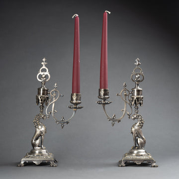 A PAIR OF FRENCH 19TH CENTURY NEO-RENAISSANCE ST. SILVERED METAL CANDLESTICKS.