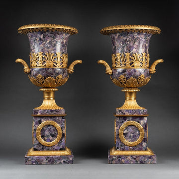 A PAIR OF FRENCH TURN OF THE CENTURY EMPIRE ST. AMETHYST AND GILT-BRONZE URNS.
