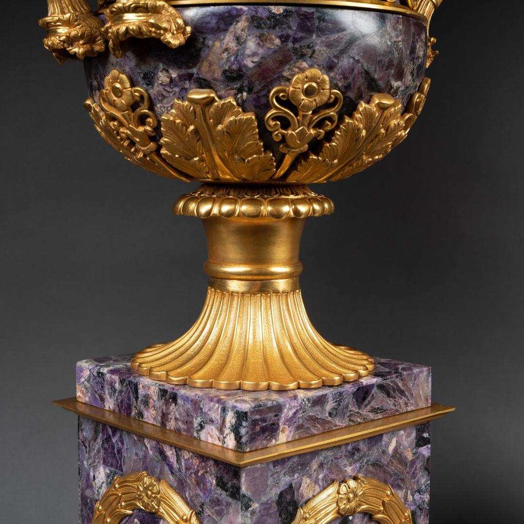 A PAIR OF FRENCH TURN OF THE CENTURY EMPIRE ST. AMETHYST AND GILT-BRONZE URNS. - Galerie Rosiers
