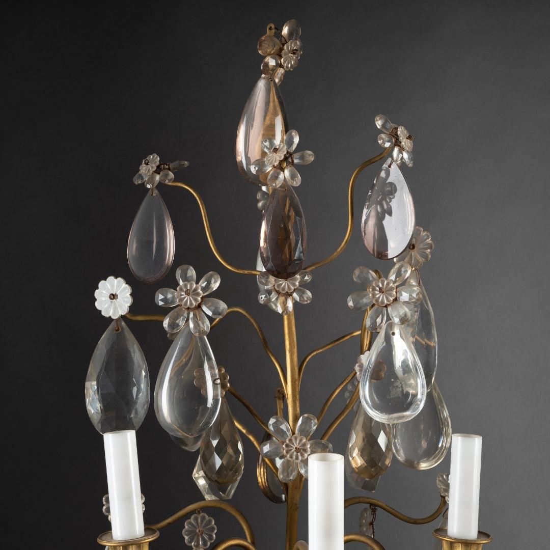 A PAIR OF FRENCH TURN OF THE CENTURY LOUIS XVI ST. CRYSTAL AND BRASS GIRANDOLES IN THE MANNER OF BAGUES. - Galerie Rosiers
