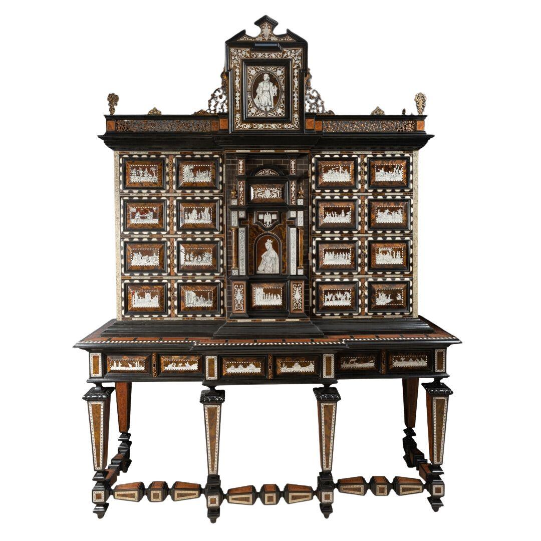 A STRIKING EARLY 19TH CENTURY SPANISH EBONIZED FRUITWOOD, ROSEWOOD, IVORY AND TORTOICE SHELL CABINET. - Galerie Rosiers