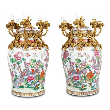 AN OUTSTANDING PAIR OF FRENCH 19 TH CENTURY ORMOLU MOUNTED PORCELAIN VASES.